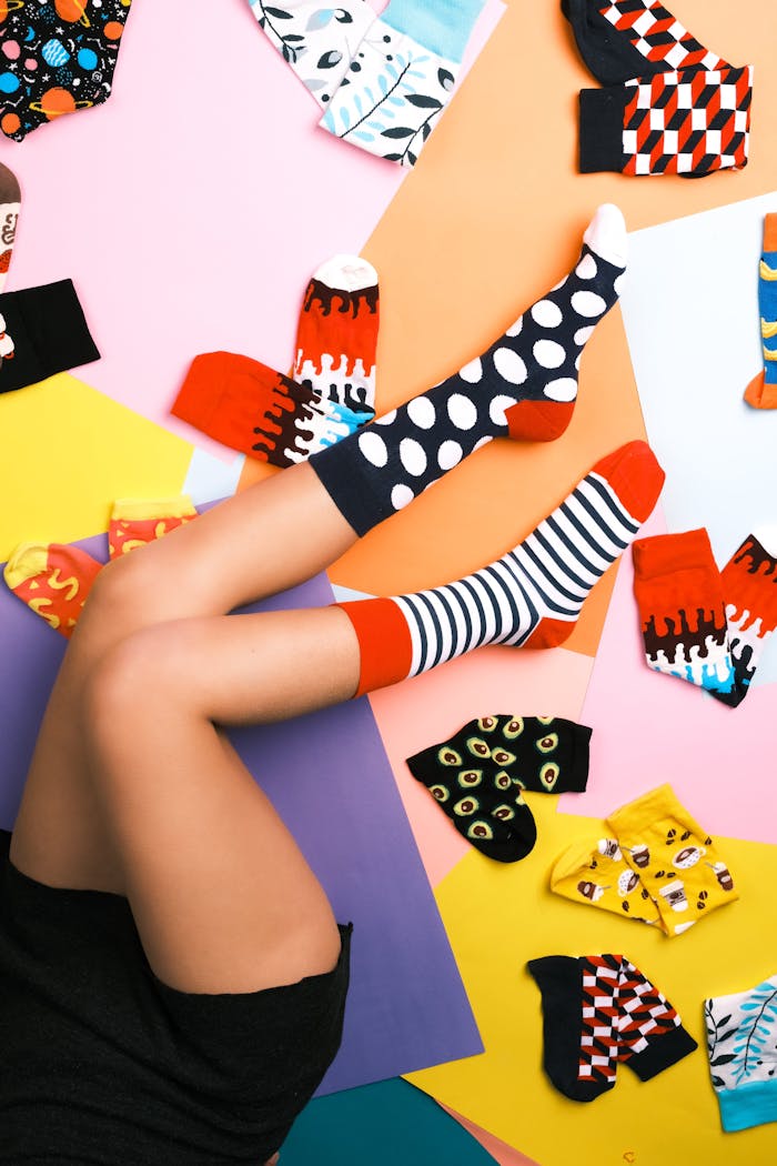 Home Vibrant patterned socks on legs showcasing various colorful designs in İstanbul.